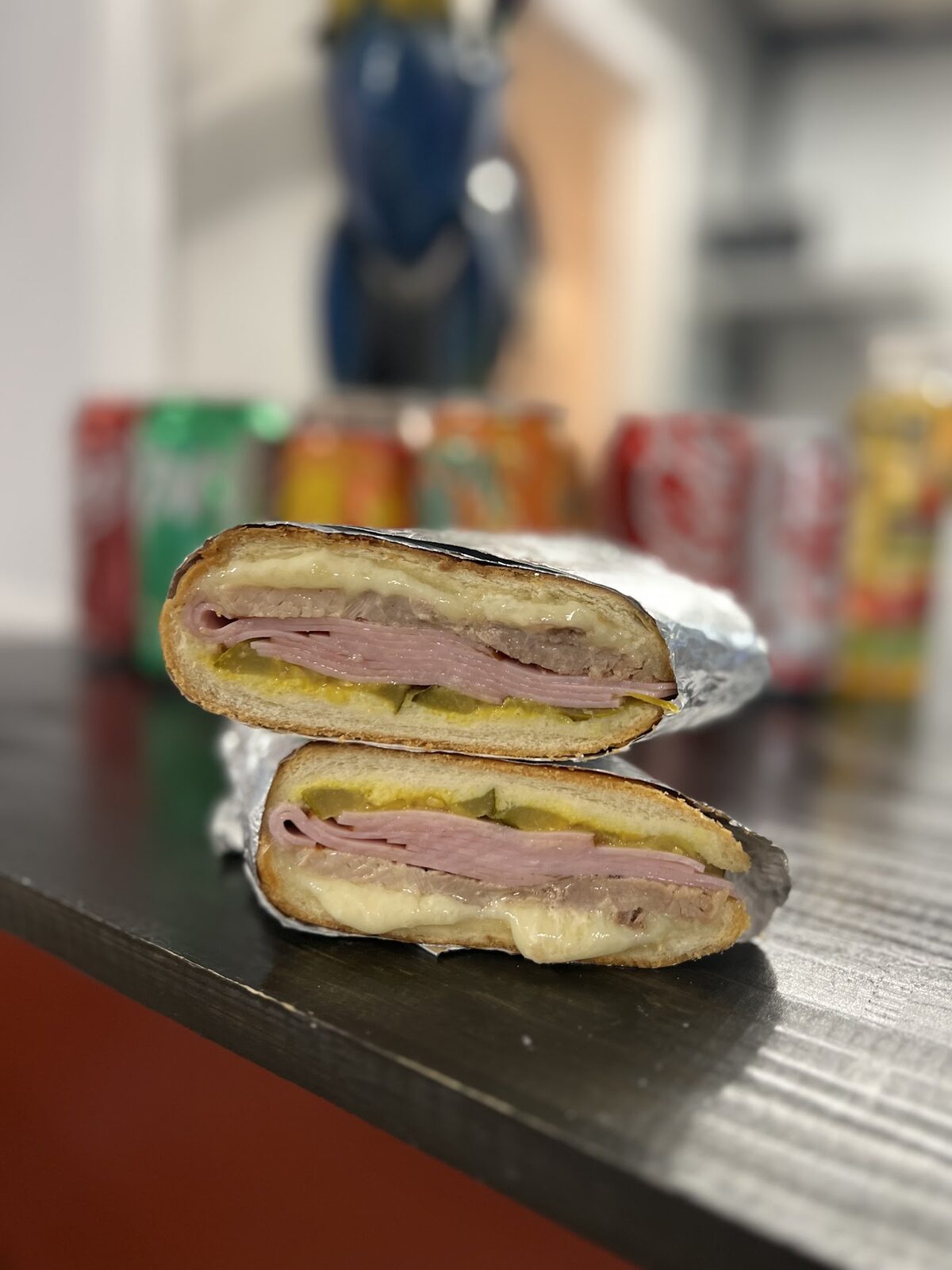 Pressed Cuban sandwich cut in half at Tony's Cafe